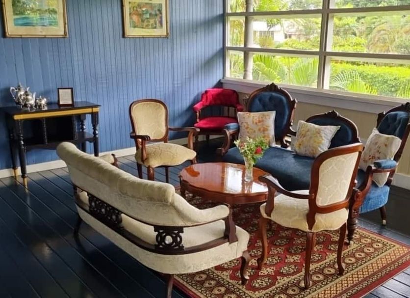 The Samoan Outrigger Hotel in Apia lounge with sofas, chairs, coffee table and large windows