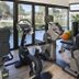 Grand Prix Hôtel & Restaurant in Le Castellet gym with exercise bikes and pool views