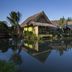 Asita Eco Resort in Samut Songkhram with overwater thatched villas reflected in a शांत lagoon