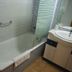 Águilas de los Collados in Águilas bathroom with bathtub, glass shower screen, and sink vanity