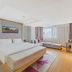 Lavande Hotels Nanjing Confucius Temple Daguang Road guest room with king bed, sofa, and city view in Nanjing