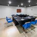 City Express Junior by Marriott Veracruz Aeropuerto meeting room with U-shaped table and blue chairs