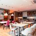Premier Inn Karlsruhe City Am Wasserturm dining area with white tables and pink chairs in Karlsruhe