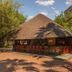 Peermont Metcourt Inn at the Grand Palm, Gaborone outdoor thatched bar with seating