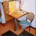 Matsuyama Youth Hostel in Matsuyama with compact bunk beds and a small desk area