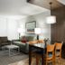 West Coast Suites At Ubc in Vancouver: hotel suite with sofa, dining table, chairs and armchair