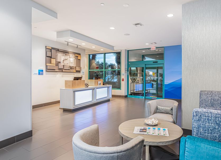 Holiday Inn Express Pensacola Beach by IHG lobby with seating area and front desk in Pensacola Beach