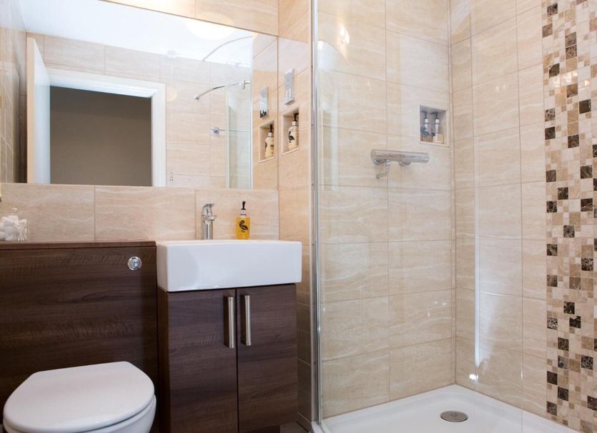 The Peel Aldergate, Tamworth bathroom with glass shower, wall tiles, vanity and toilet