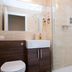 The Peel Aldergate, Tamworth bathroom with glass shower, wall tiles, vanity and toilet