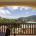The Palm Seychelles in Bel Ombre balcony view of lush hills, rooftops and the ocean