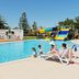 The Retreat at West Beach Parks pool with families, sun loungers and waterslide at West Beach