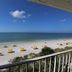 Shoreline Island Resort in Madeira Beach with oceanfront balcony view of beach and umbrellas