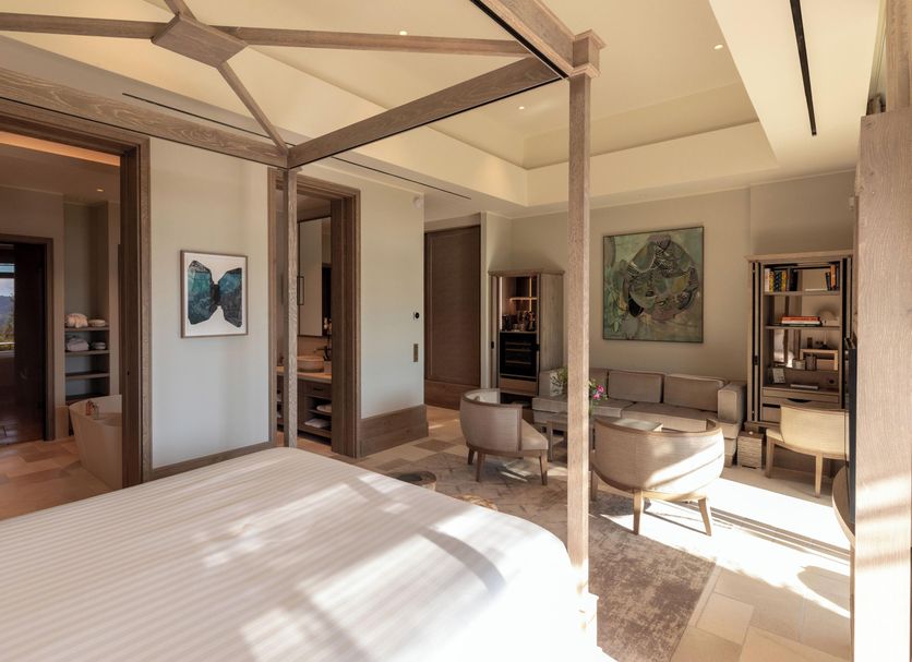 Coquillade Provence - Relais & Châteaux in Gargas, sunlit suite with canopy bed and sitting area