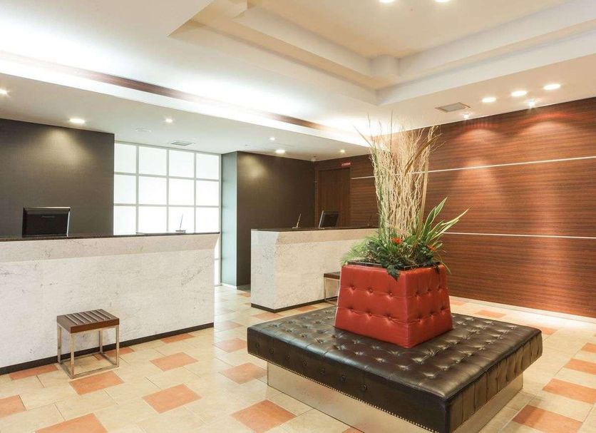 Hotel Mystays Sakaisuji Honmachi lobby in Osaka with front desk and tufted seating