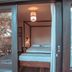 Pousada Fortal Jeri bedroom with canopy bed and glass doors in Jijoca de Jericoacoara