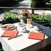 Hotel Ristorante Vecchia Riva in Varese: outdoor table set for breakfast beside a garden path