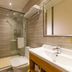 Hi Inn (Shanghai Zhongshan Park Wuyi Road) bathroom with glass shower, sink, and toilet in Shanghai
