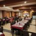 Hotel Shreehari Grand in Puri dining hall with set tables and chairs