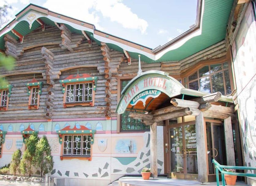 Power Park Accommodation in Kauhava, colorful rustic hotel exterior with entrance and carved wood details