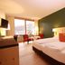 Spa Hotel Erzherzog Johann in Bad Aussee guest room with twin beds, balcony view and seating area
