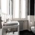 Casa Brenna Tosatto Art Experience bathroom in Lenno with sink, toilet, shower, and window