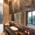 Voga Motel Taichung City bathroom with freestanding tub, stone walls, double vanity and floor-to-ceiling window