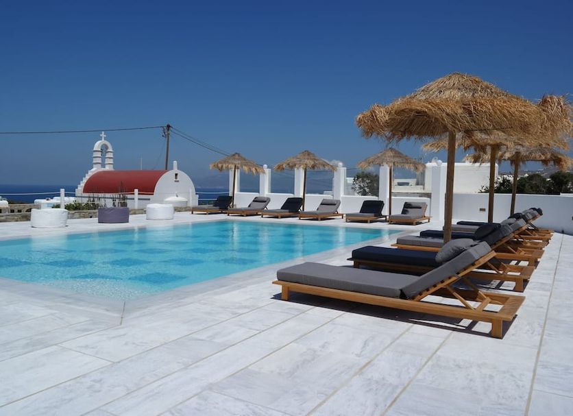 Margie Mykonos Hotel rooftop pool with loungers and sea view in Mykonos