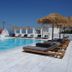 Margie Mykonos Hotel rooftop pool with loungers and sea view in Mykonos