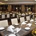 Rayentray Grand Hotel in Puerto Madryn dining room with set tables and chairs