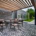 Courtyard by Marriott Toledo West in Toledo, outdoor patio with seating under a slatted pergola