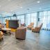 Courtyard by Marriott Toledo West lounge with seating around a central fireplace in Toledo