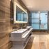 Novotel Zhengzhou Convention Centre bathroom with double vanity, glass shower and freestanding tub in Zhengzhou