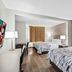 Red Roof Inn Etowah - Athens, TN guest room with two beds and wood-look flooring in Etowah
