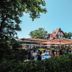 Boutique Hotel Waldhaus in Birsfelden outdoor terrace dining area with guests and trees