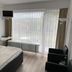Hotel Martina in Bad Sooden-Allendorf guest room with bed, desk, TV and floor-to-ceiling window