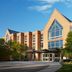 Haworth Hotel at Hope College in Holland exterior with large glass entrance and peaked roof