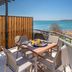 Hotel Nafpaktos terrace table with breakfast and chairs overlooking the sea in Nafpaktos
