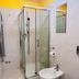 L'Affittacamere di Venezia bathroom in Venice with glass shower, sink, toilet paper holder and mirror