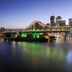 Il Mondo Boutique Hotel in Brisbane with river view of the illuminated Story Bridge and city skyline