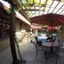 Ridgemark Golf Club And Resort in Hollister patio dining area with tables, chairs, and red umbrellas