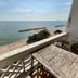 Banchaitalay Room in Rayong with balcony overlooking the beach and sea