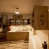 Che Juan Hostel Ba in Buenos Aires kitchen with wooden cabinets, checkered floor and lit counter
