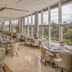 Golden Tulip Canaan Kampala restaurant with large windows and city views in Kampala