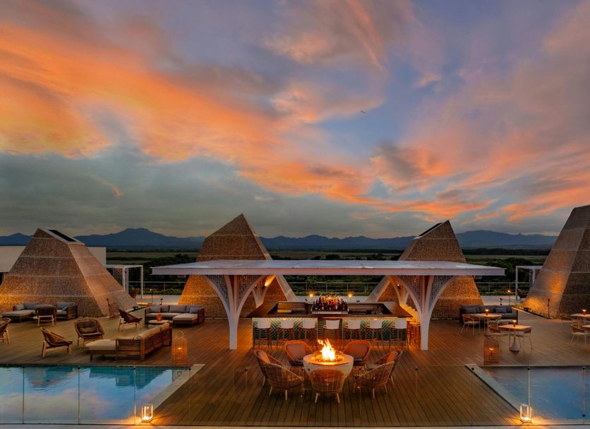 W Punta Cana, All-Inclusive rooftop terrace with fire pit, pool, and sunset mountain view in Uvero Alto