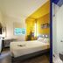 ibis budget Amsterdam Airport room in Badhoevedorp with bed, desk, window, and shower cabin