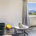 Seaside Secret by BluPine in Vouliagméni room with sea view, window, sofa and TV