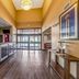 Quality Inn West Plano - Dallas lobby with front desk, wood-look floor, and glass entrance in Plano