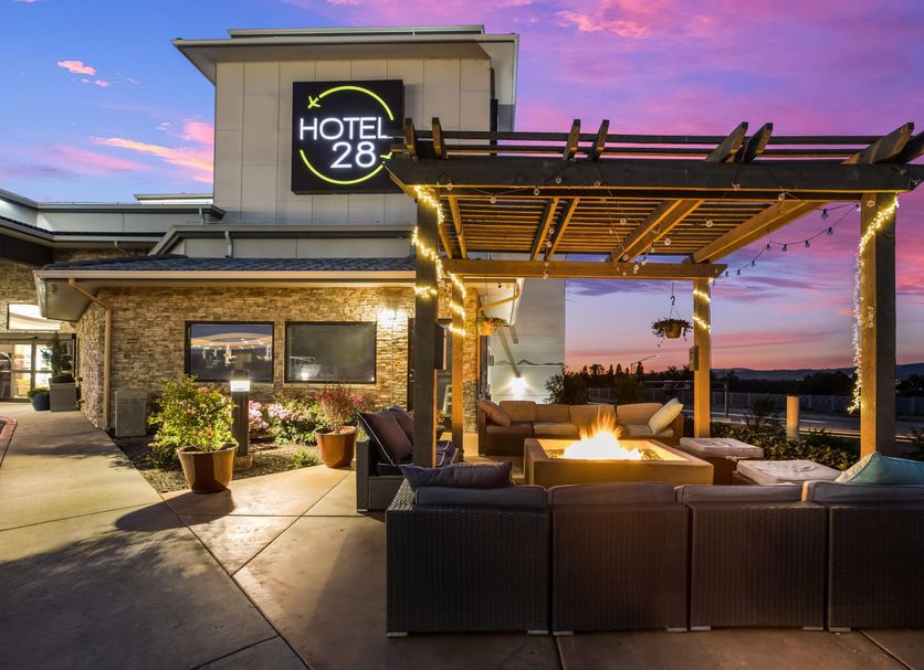 Hotel 28 Boise Airport in Boise with outdoor fire pit lounge and sunset sky