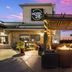 Hotel 28 Boise Airport in Boise with outdoor fire pit lounge and sunset sky