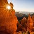 Sunlit canyon rock formations at High Desert Inn in Salina with a distant desert valley view